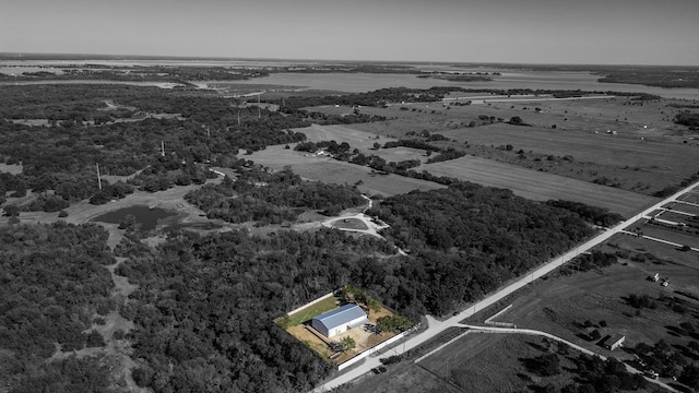 birds eye view of property with a rural view