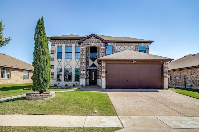 view of front of house featuring a garage and a front lawn