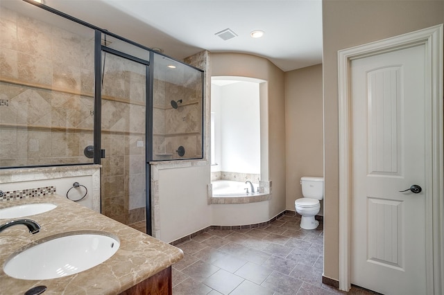 full bathroom featuring separate shower and tub, vanity, and toilet