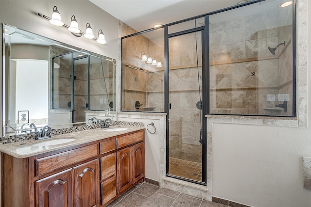 bathroom featuring vanity and a shower with shower door