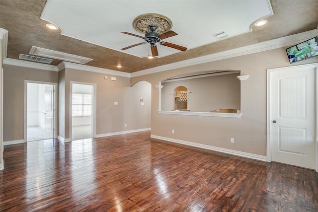 unfurnished room with crown molding, dark hardwood / wood-style floors, and ceiling fan