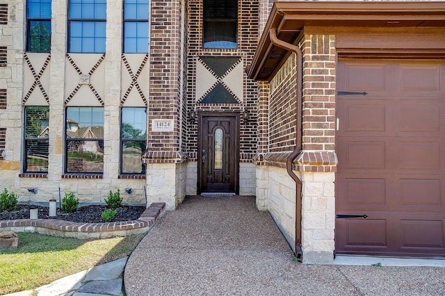 property entrance with a garage