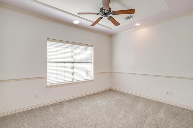 empty room featuring carpet floors, ornamental molding, and ceiling fan