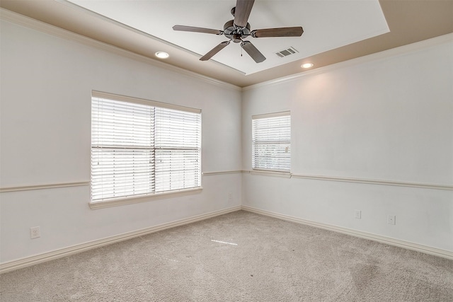 carpeted empty room with ceiling fan and ornamental molding