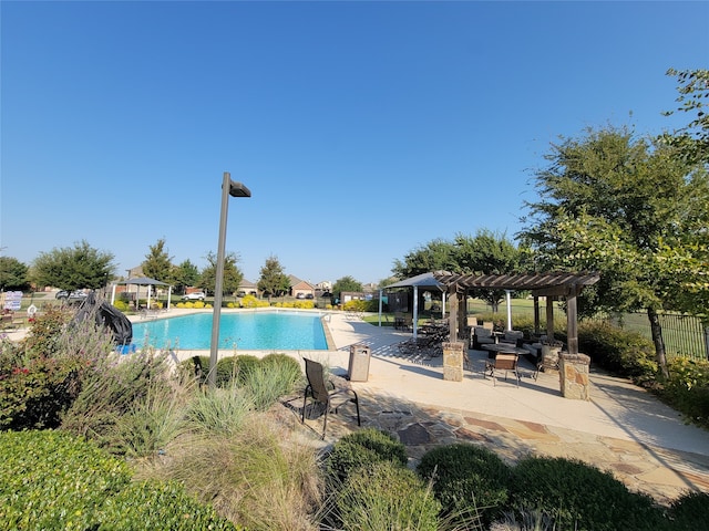 view of swimming pool with a pergola and a patio