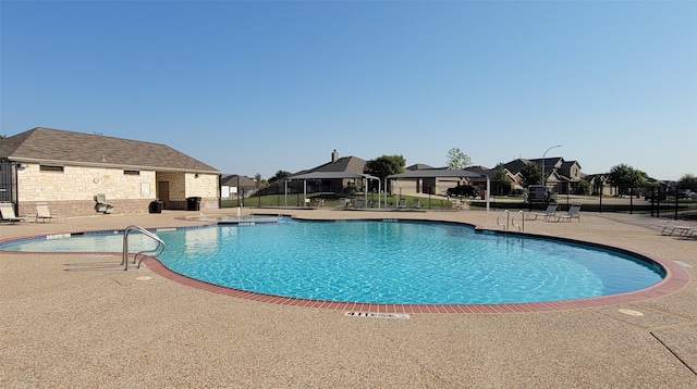 view of pool featuring a patio