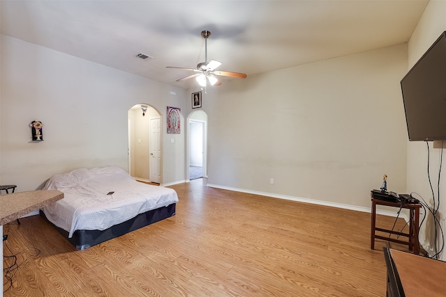 bedroom featuring ceiling fan and light hardwood / wood-style flooring