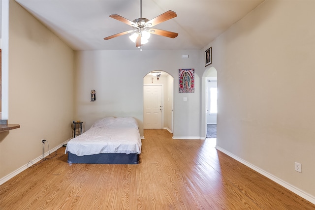 bedroom with ceiling fan and light hardwood / wood-style flooring