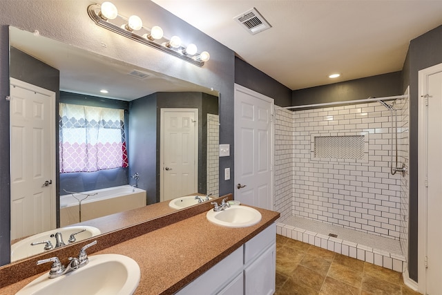 bathroom with vanity, shower with separate bathtub, and tile patterned flooring