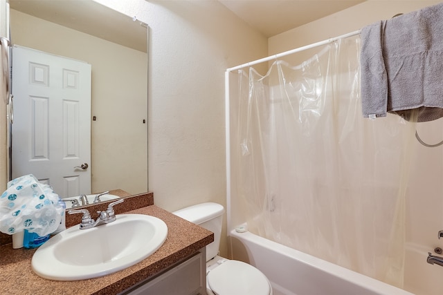 full bathroom with shower / bath combo with shower curtain, vanity, and toilet