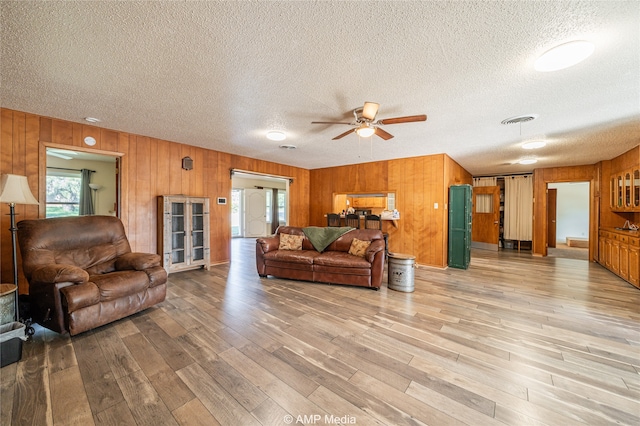 living room with hardwood / wood-style flooring and a textured ceiling