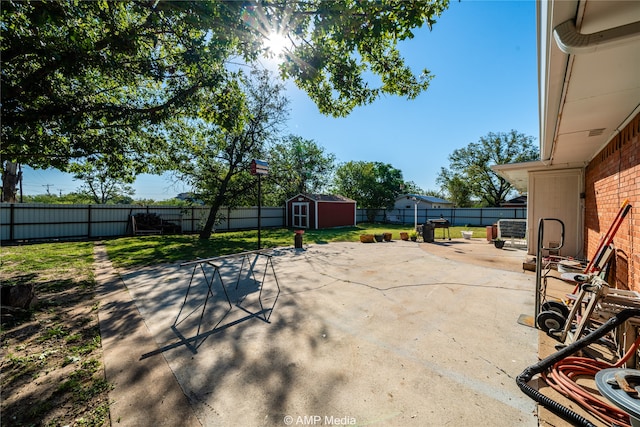 view of patio with a storage shed