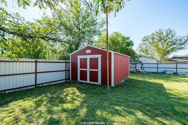 view of outdoor structure with a lawn