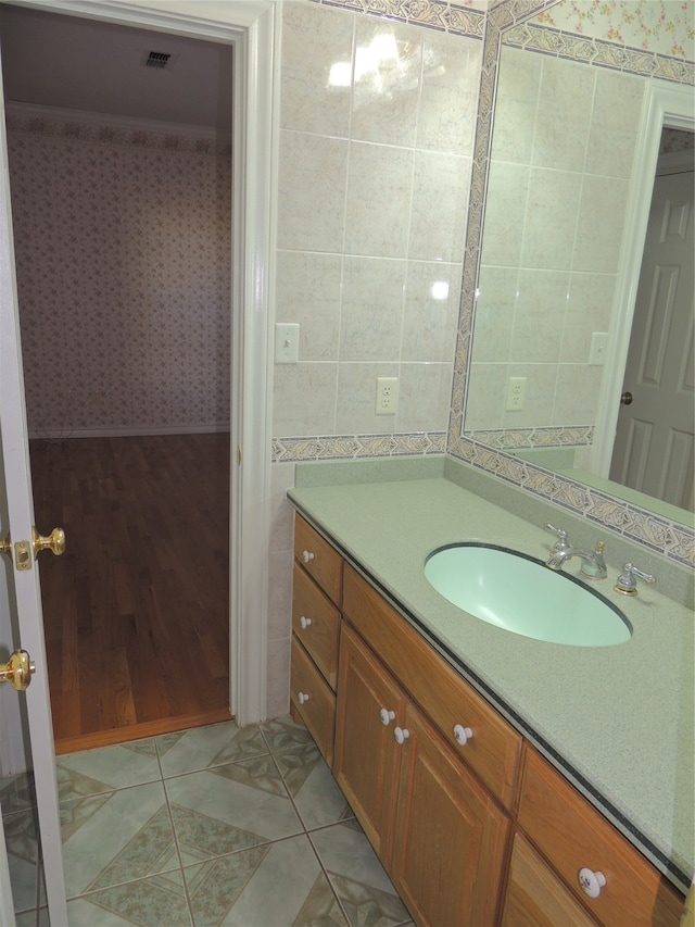 bathroom featuring vanity and wood-type flooring