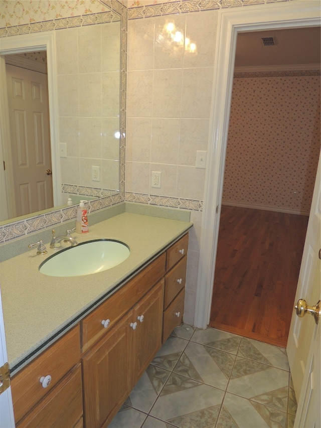 bathroom with vanity and hardwood / wood-style flooring