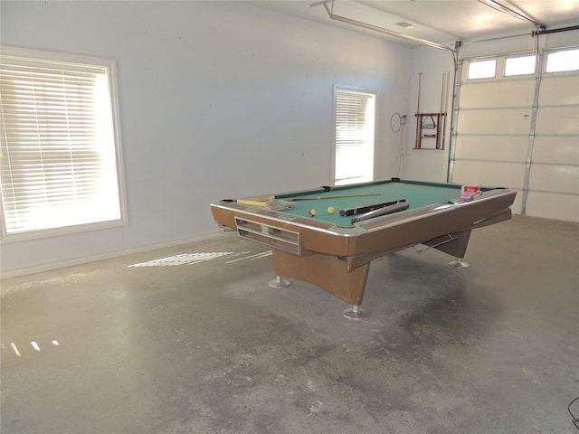 game room featuring plenty of natural light, concrete flooring, and billiards