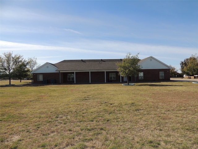 ranch-style home with a front lawn