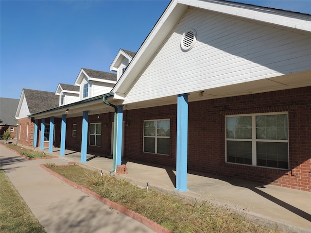 view of property exterior featuring a porch