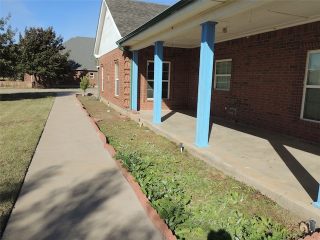 view of home's exterior with a lawn