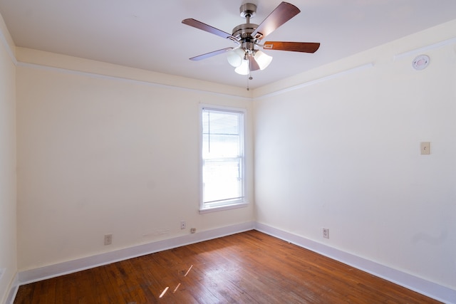 empty room featuring ceiling fan and hardwood / wood-style flooring