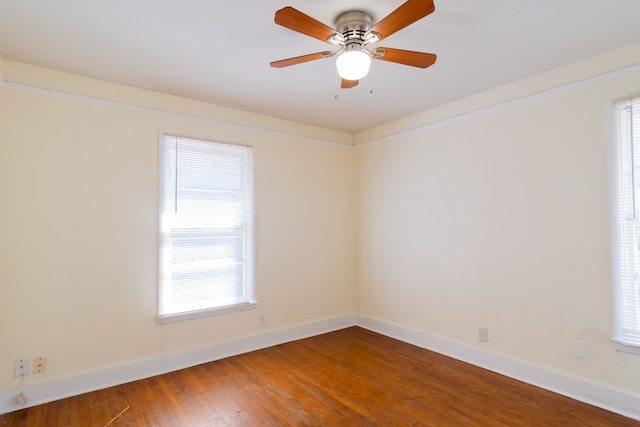 empty room featuring ceiling fan and hardwood / wood-style flooring