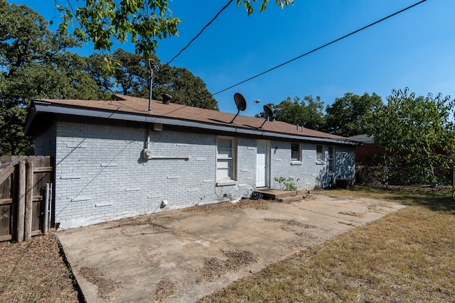 back of house featuring a yard and a patio area