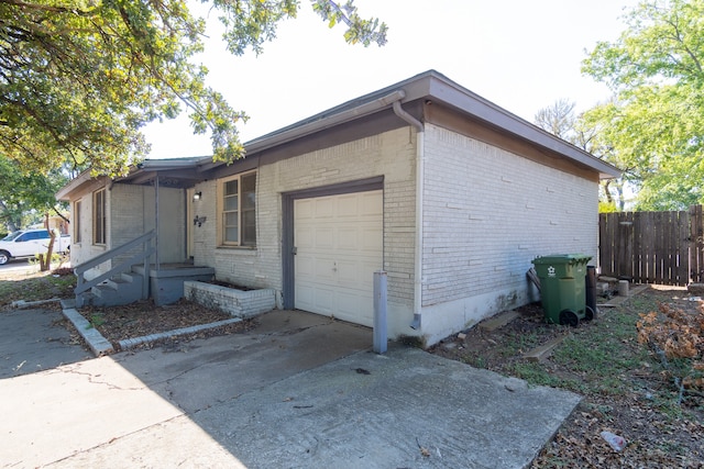 view of side of home with a garage