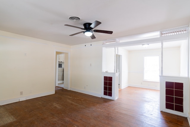 spare room with ceiling fan and hardwood / wood-style flooring