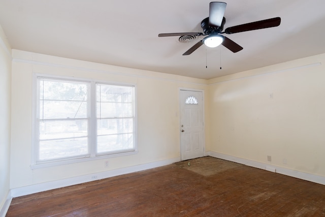 foyer with ceiling fan and dark wood-type flooring