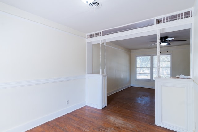 spare room featuring ceiling fan and dark hardwood / wood-style floors