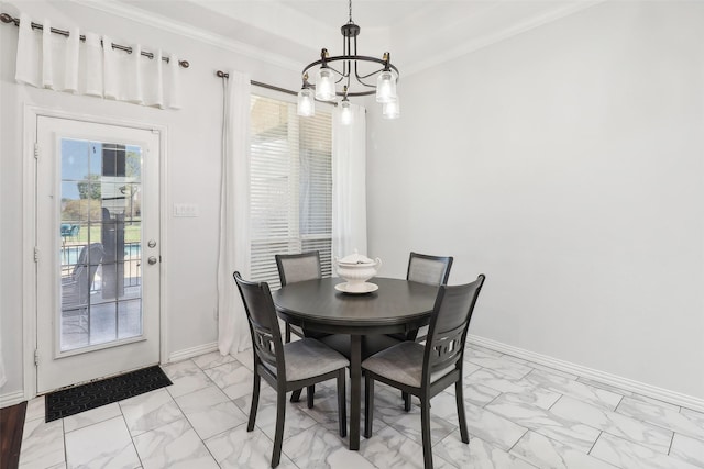 dining area featuring a wealth of natural light, a chandelier, and crown molding