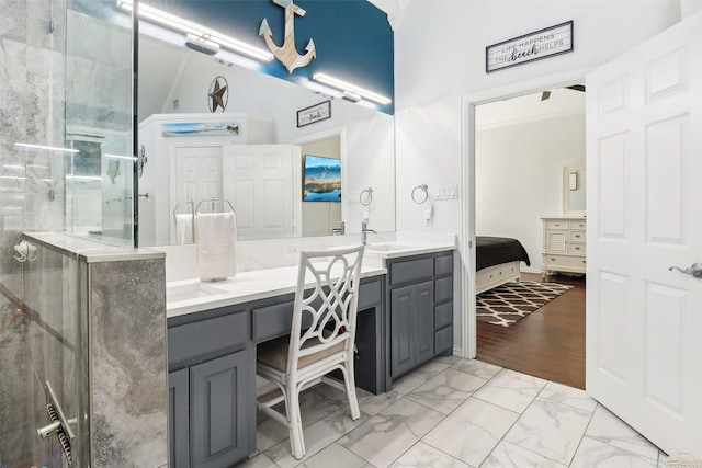 bathroom featuring a shower with shower door, hardwood / wood-style flooring, and vanity