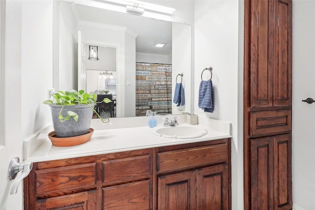 bathroom with vanity and crown molding