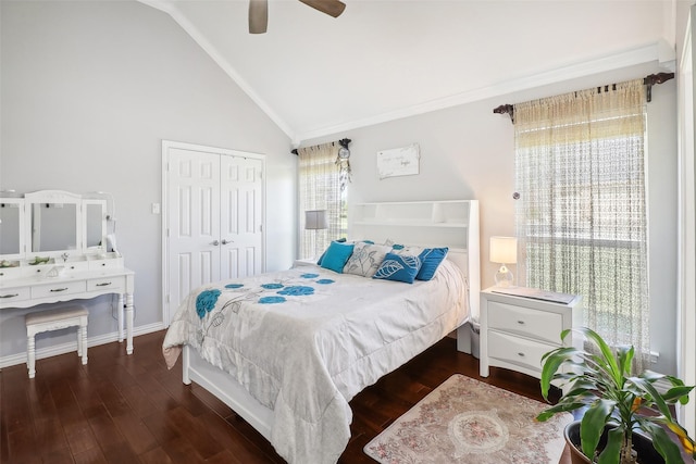 bedroom with ceiling fan, a closet, dark hardwood / wood-style flooring, and lofted ceiling