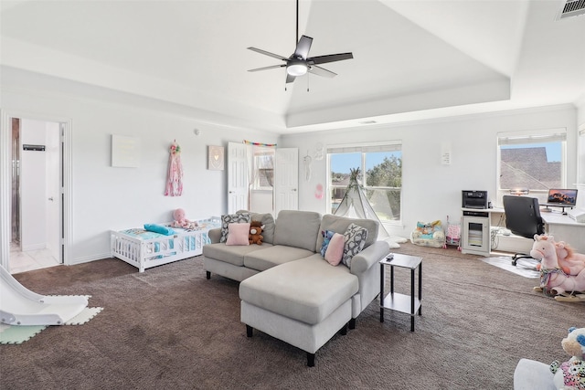 carpeted living room featuring ceiling fan, a tray ceiling, and wine cooler