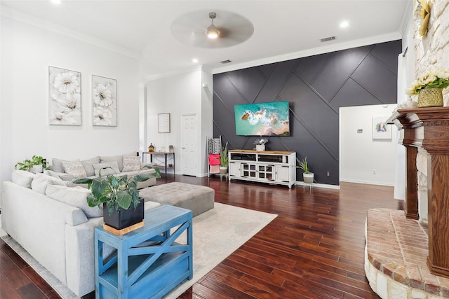 living room featuring ceiling fan, ornamental molding, and dark hardwood / wood-style floors