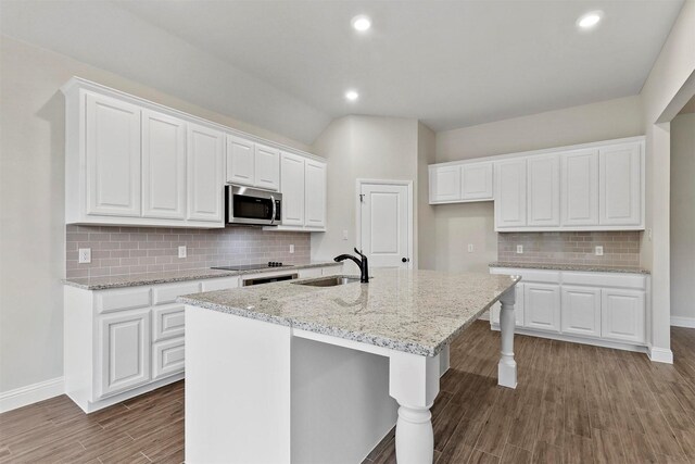 kitchen with pendant lighting, dishwasher, a healthy amount of sunlight, and white cabinetry