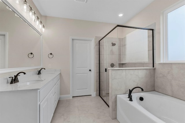 bathroom with vanity, tile patterned flooring, and plus walk in shower