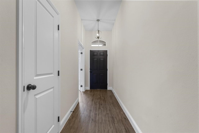 corridor with dark wood-type flooring