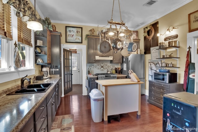 kitchen with dark hardwood / wood-style flooring, wooden counters, crown molding, dark brown cabinets, and sink