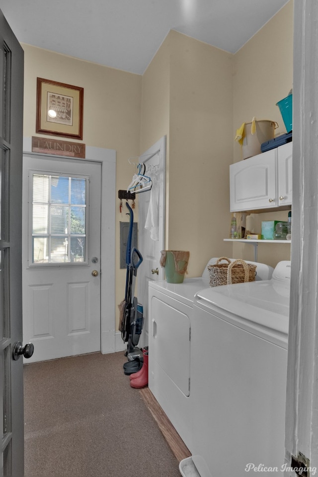 washroom with carpet floors, washer and clothes dryer, and cabinets