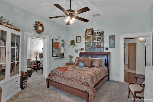 bedroom featuring ceiling fan and light colored carpet