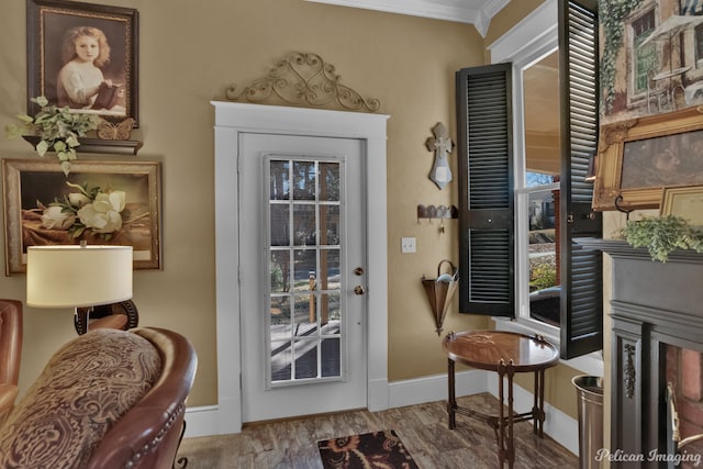 doorway to outside featuring crown molding