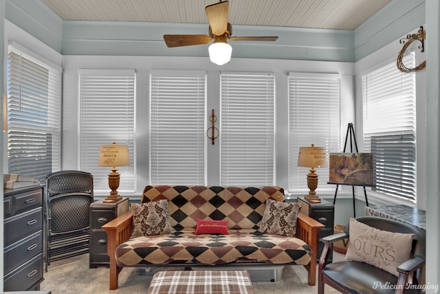 interior space with carpet flooring and ceiling fan