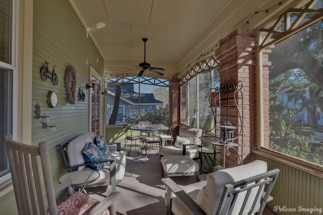 view of patio with ceiling fan and an outdoor living space