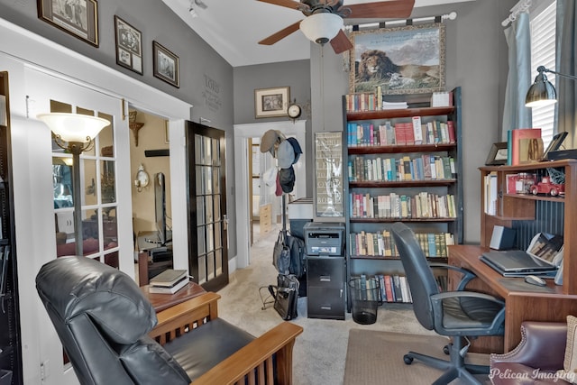 carpeted office with ceiling fan and french doors