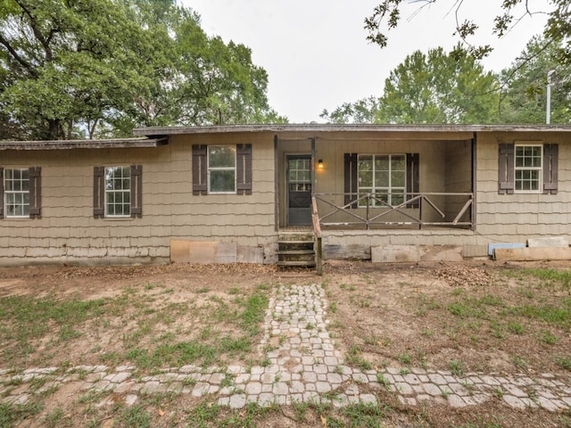 single story home with covered porch