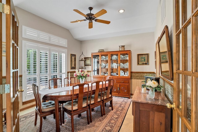 dining area featuring ceiling fan, french doors, and vaulted ceiling