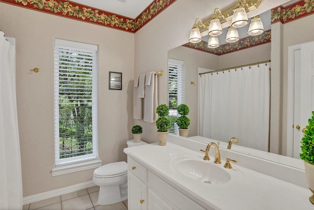 bathroom featuring tile patterned flooring, vanity, and toilet