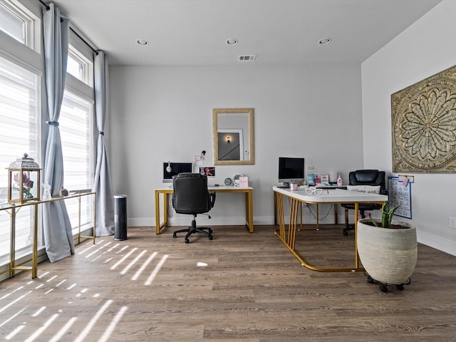 office area with recessed lighting, visible vents, baseboards, and wood finished floors